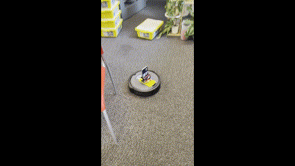 A Create 3 robot driving around a classroom from a student perspective